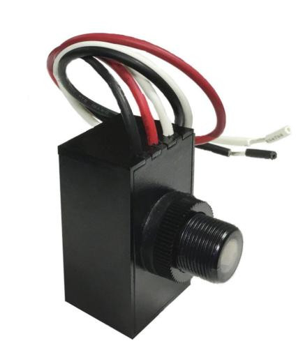 SLG Lighting Button Photocell 120V-277V, black rectangular device with a cylindrical sensor and wires for electrical connection.