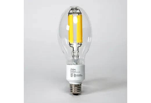Halco LED HID Filament ED23.5 Lamp 20W 4000K E26 Base 3600 Lumens, image of a clear glass LED filament bulb with yellow LED filaments inside and a standard screw base.
