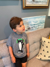Child wearing the Sweetpea and Boy orca soccer graphic T-shirt