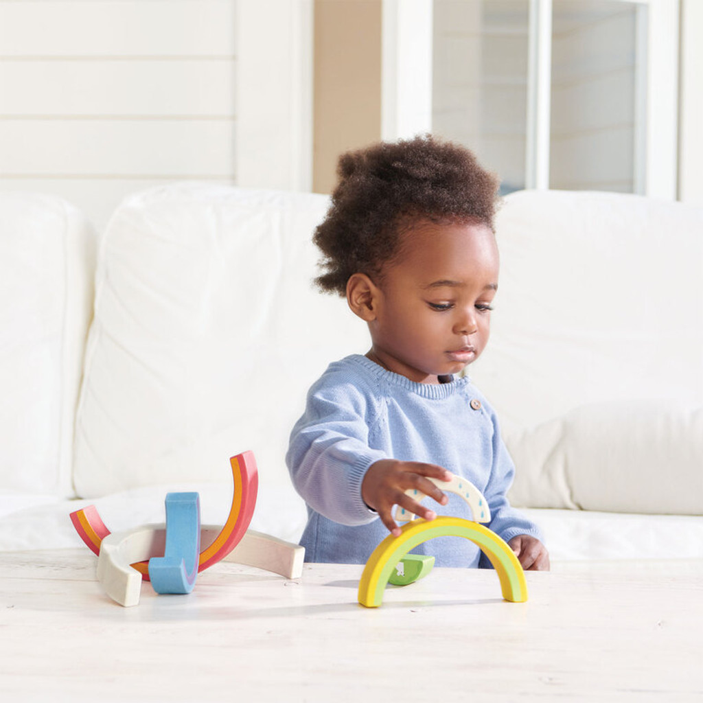 Tender Leaf Toys Rainbow Tunnel with small child