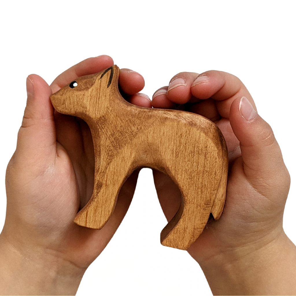 NOM Handcrafted Calf wooden toy size in hands