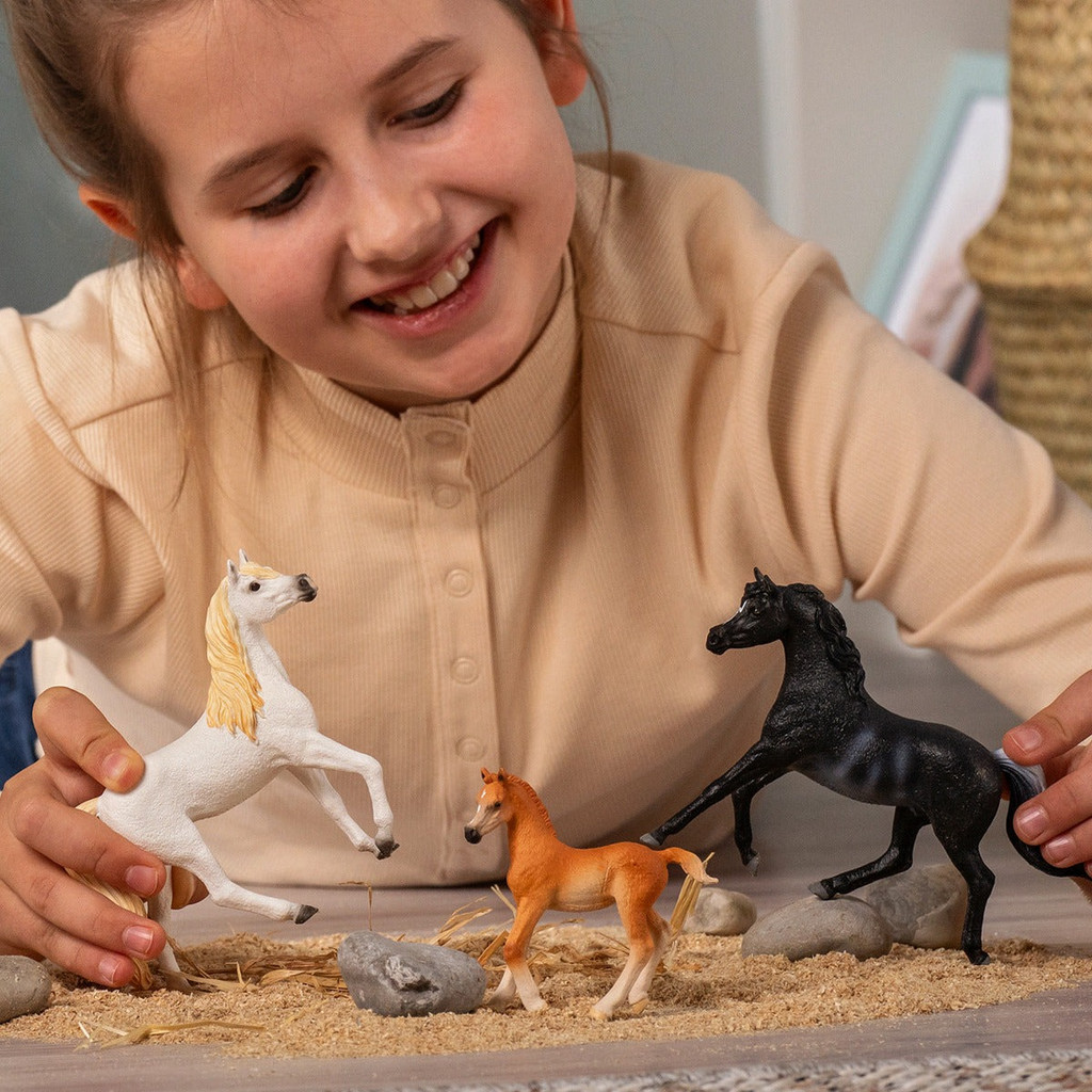 Schleich realistic Arabian horse family in play