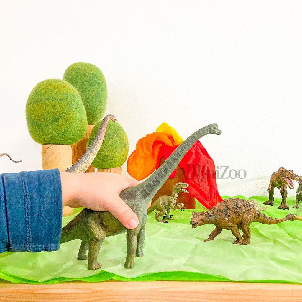 CollectA Brachiosaurus toy in child's hands MiniZoo