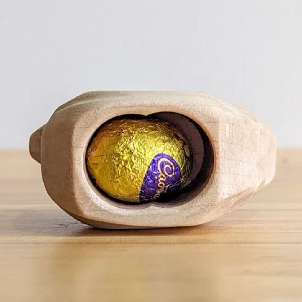Nom Handcrafted hen laying egg wooden toy with small cadbury egg