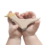 NOM Handcrafted Cockatoo wooden toy in hands