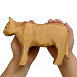 NOM Handcrafted wooden Cow size in hand