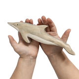 NOM Handcrafted wooden Dolphin toy size in hands