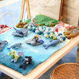 Tara Treasures felt balls on playmat 