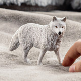 Schleich Arctic Wolf toy size in hand lifestyle
