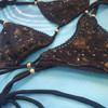 Shimmery bikini set in black-gold S/M 