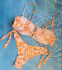 Bikini set including : lettuce hem V-bone front bandew top and Brazilian bottom. M/L