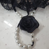 "Rosetta" G- string with frilled lace, pearly beads and rose details in black. Size S/M. 