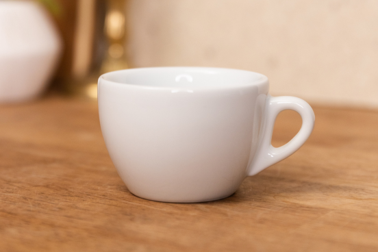 A Verona Cappuccino mug sitting on a countertop.