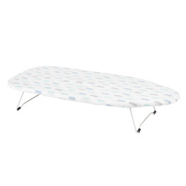 White tabletop ironing board with geometric patterned cover, foldable legs