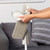 Grey microfibre mop head being attached to cleaning tool