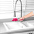 Grey plastic dustpan with pink rubber edge, shown from above.