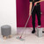 Flat mop and grey cleaning bucket in use on light wood floor