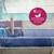 Clothes hanging on indoor airer with circle promoting less tumble-drying and eco benefits