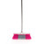 Laundry drying rack, ironing board and cleaning accessories in white and pink on display.