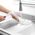 Pink and white round cleaning brush with handle, shown upright on white background