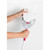Fitting white cleaning pad onto pink and grey mop head, shown against tiled wall.