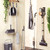 Indoor laundry set with drying rack, cleaning tools, and laundry basket in home setting