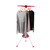 Rotary indoor clothes airer with grey, pink and black jumpers on hangers