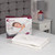 Kleeneze heated under blanket, double size, shown with controller and packaging on bed.