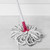 White and grey twist mop with pink handle cleaning tiled floor