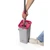 Grey and pink flat mop bucket in use, showing washing and drying compartments