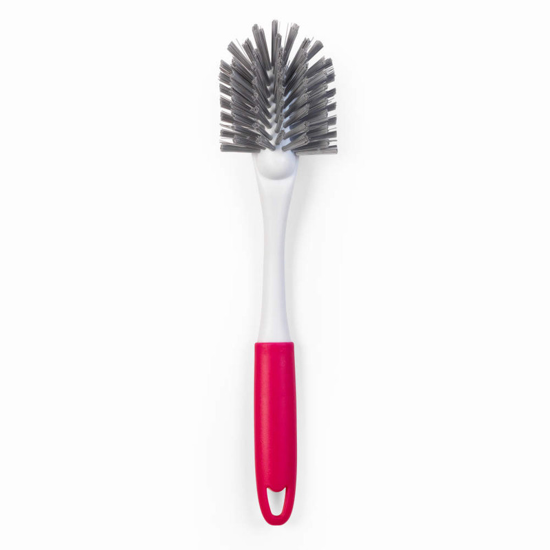 Dish brush with angled grey bristles and pink handle, shown on white background