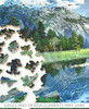 Pieces taken apart from the Yosemite Spring wooden jigsaw puzzle, unveiling a spring located within the snow-capped mountains of Yosemite National Park. The crystal clear water creates a mirror effect as it reflects the mountains and blue sky.