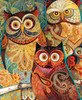 Close up of Wise Guys wooden jigsaw puzzle, transporting viewers to the forest as they come eye-to-eye with five owls. The owls sit next to each other on a tree branch, while one owl sits in front of them. The various sized owls have big bright eyes that stare straight ahead with their bodies decorated in paisley designs. The background is filled with leaves and flowers.