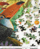 Pieces taken apart of Tropical Interlude wooden jigsaw puzzle featuring a toucan sitting on a branch in the rainforest. Edges and design elements may vary.