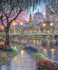Close-up of Lagoon Bridge wooden jigsaw puzzle showcasing an evening scene in the park along the bay. Trees and flowers bloom as petals fall on a pathway leading to a bridge. Across the bridge is a statue of a man on horseback with city buildings in the background.