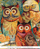 Close-up of Wise Guys wooden jigsaw puzzle, transporting viewers to the forest as they come eye-to-eye with five owls. The owls sit next to each other on a tree branch, while one owl sits infront of them. The various sized owls have big bright eyes that stare straight ahead with their bodies decorated in paisley designs. The background is filled with leaves and flowers.