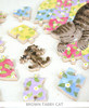 Grey and white tabby cat puzzle with colorful patchwork design