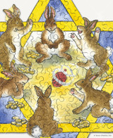  Close up of Miracles Happen wooden jigsaw puzzle showing bunnies sitting in a circle inside the Star of David as they play a fun Hanukkah game, with coins piled by their sides. A dreidel can be seen spinning in the center as the bunnies cheer of excitement. 