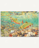  River Light wooden jigsaw puzzle goes below to surface of the water, where two brook trout enjoy the sunlight shining down on them. One fish floats just above the rocks on the streambed, as the other fish spots a fishing lure and swims up towards it. 