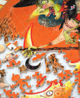  Pieces take apart of Witch Way For More Candy wooden jigsaw puzzle, unveiling a witch riding on her broom stick as she holds a jack-o-lantern candy bucket full of sweet treats. The witch is wearing her over the top attire that consists of a dress with a star and moon pattern, a black cape, blue hair, and her witch hat that is accompanied by two black cats riding on top. Three bats and a moon with a human face appear against the bright orange background. 