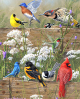  Close up of Songbird Menagerie wooden jigsaw puzzle displaying a variety of birds sitting on a wooden fence, surrounded by wildflowers on a spring day. 