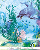  Close-up of Playtime! wooden jigsaw puzzle transporting viewers underwater with a dolphin and her two calves playing in between the seaweed and coral. A variety of fish and aquatic life swim around the family. Stone archway remains hide behind the vegetation off in the distance. 