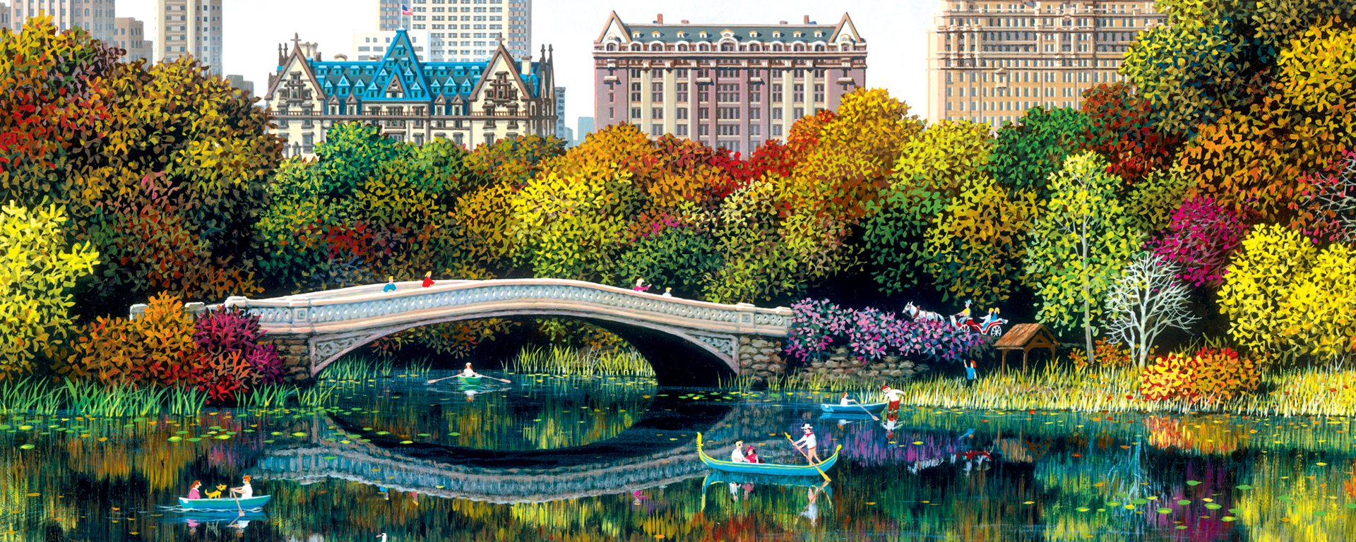bow bridge with new york city skyline with fall colored trees