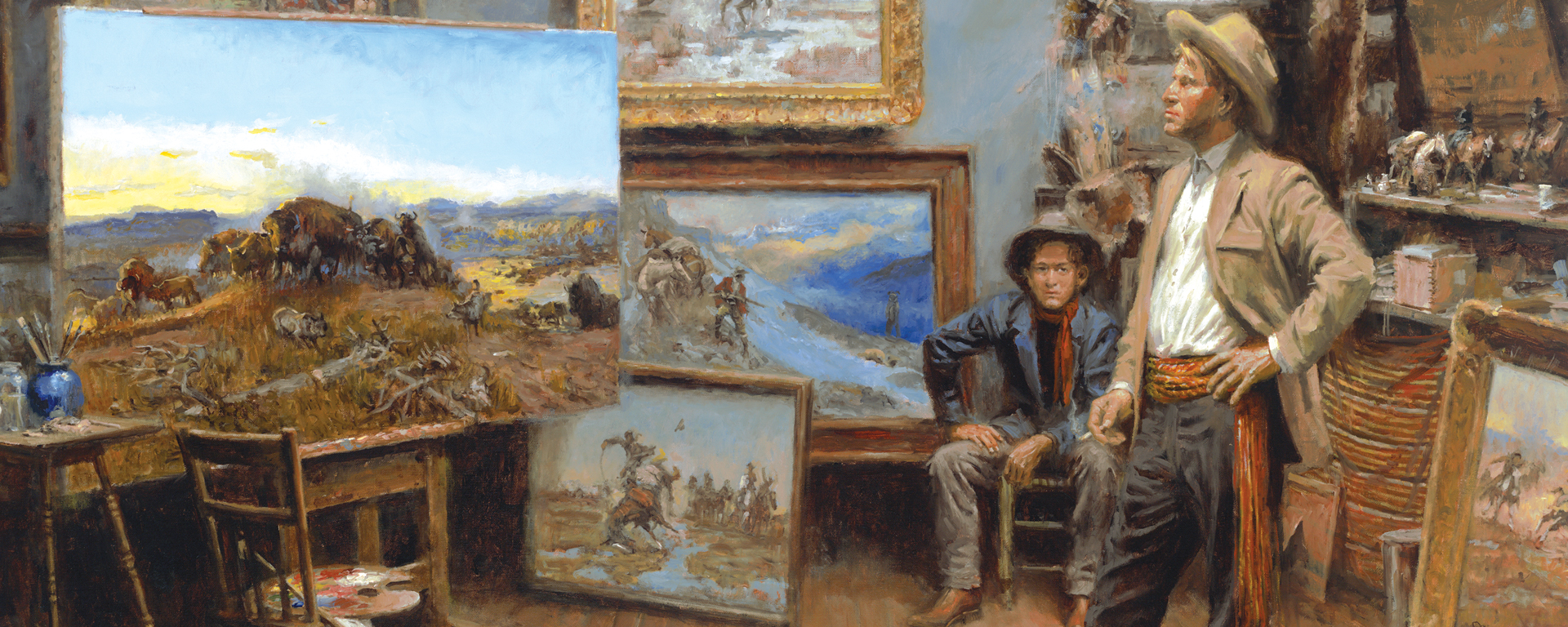 two cowboys looking at collection paintings of western scenes in artist studio