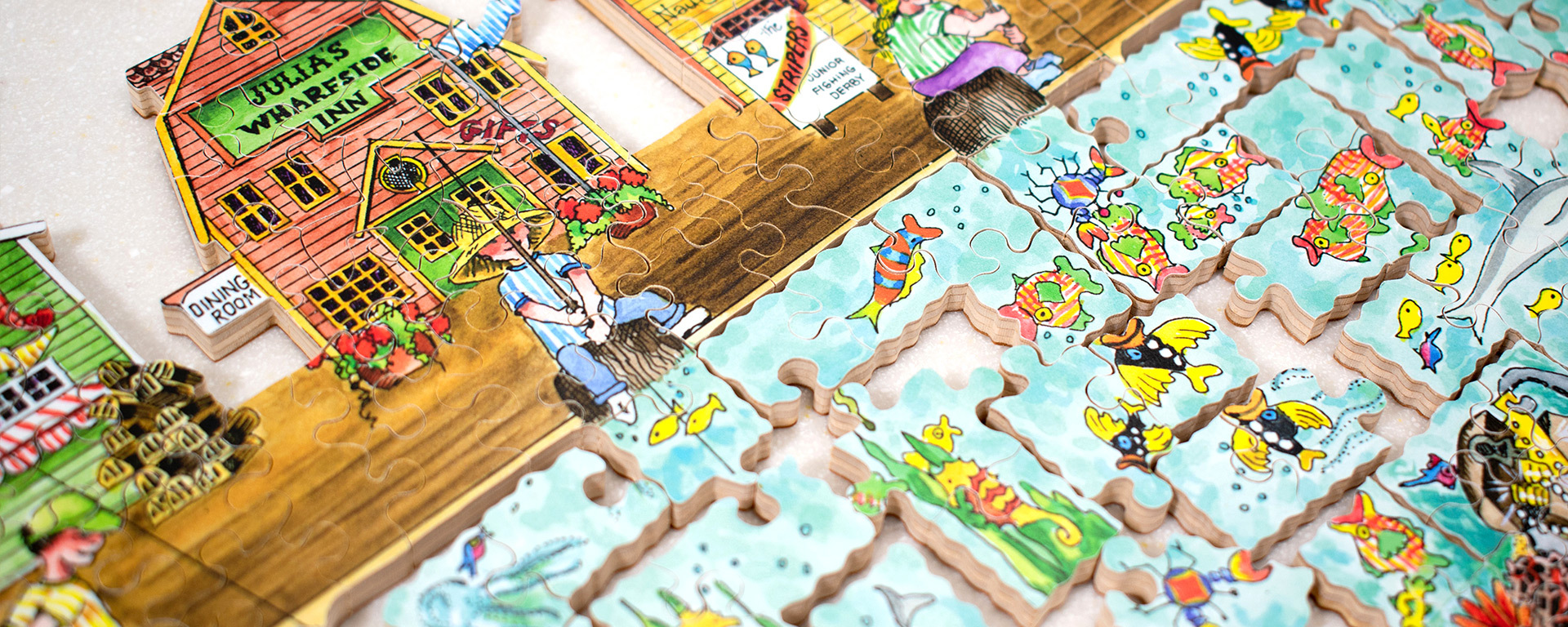 Wooden jigsaw puzzle of a person fishing on the pier.