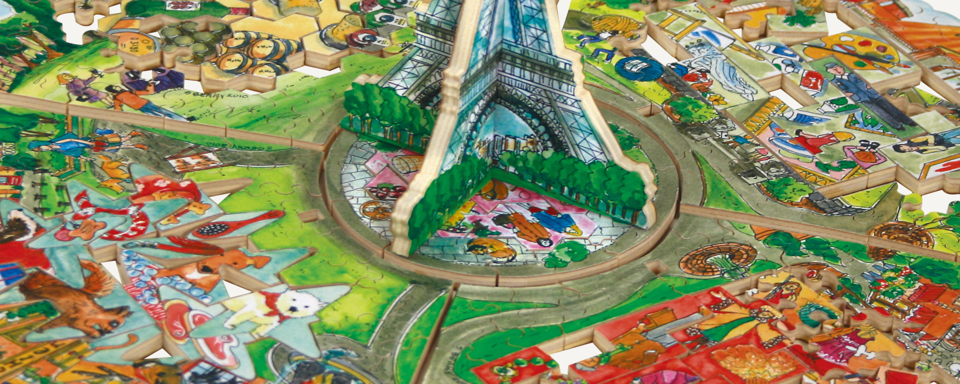 Wooden Paris puzzle showing the Eiffel Tower in the center and other scenes surrounding it. The scenes show art, wine and grapes, and various animals like a squirrel and dogs.