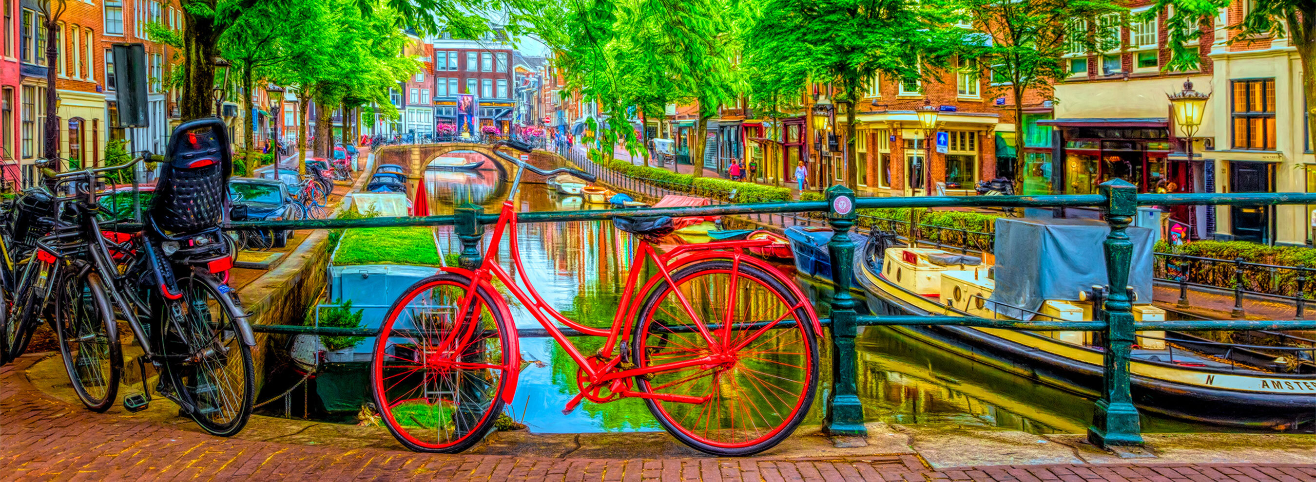 Wooden bicycle puzzle featuring a red bike in Amsterdam leaning againt the railing on a bridge over a canal.