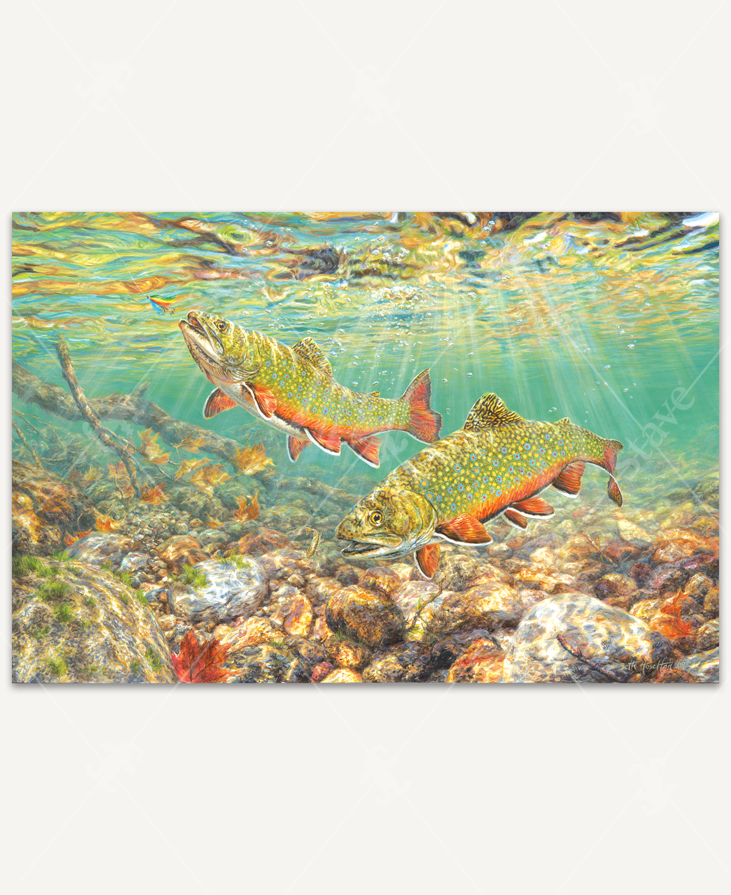 River Light wooden jigsaw puzzle goes below to surface of the water, where two brook trout enjoy the sunlight shining down on them. One fish floats just above the rocks on the streambed, as the other fish spots a fishing lure and swims up towards it.