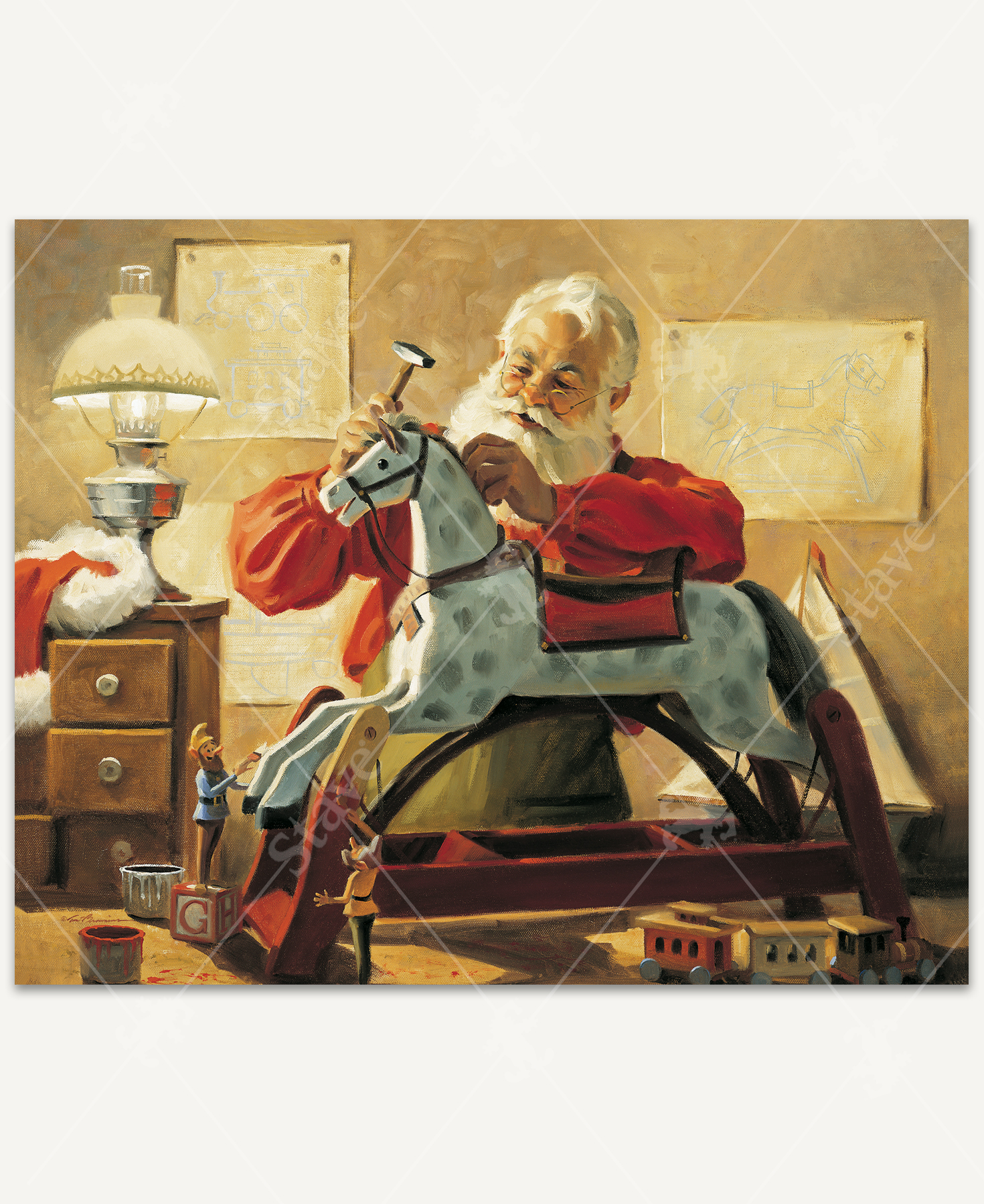 Santa Claus hammers a wooden rocking horse in his workshop while tiny elves paint it. His red hat is draped over a drawer. Behind him are sketches of toy trains, boats, and the horse. A wooden train sits in the foreground and a boat in the background.
