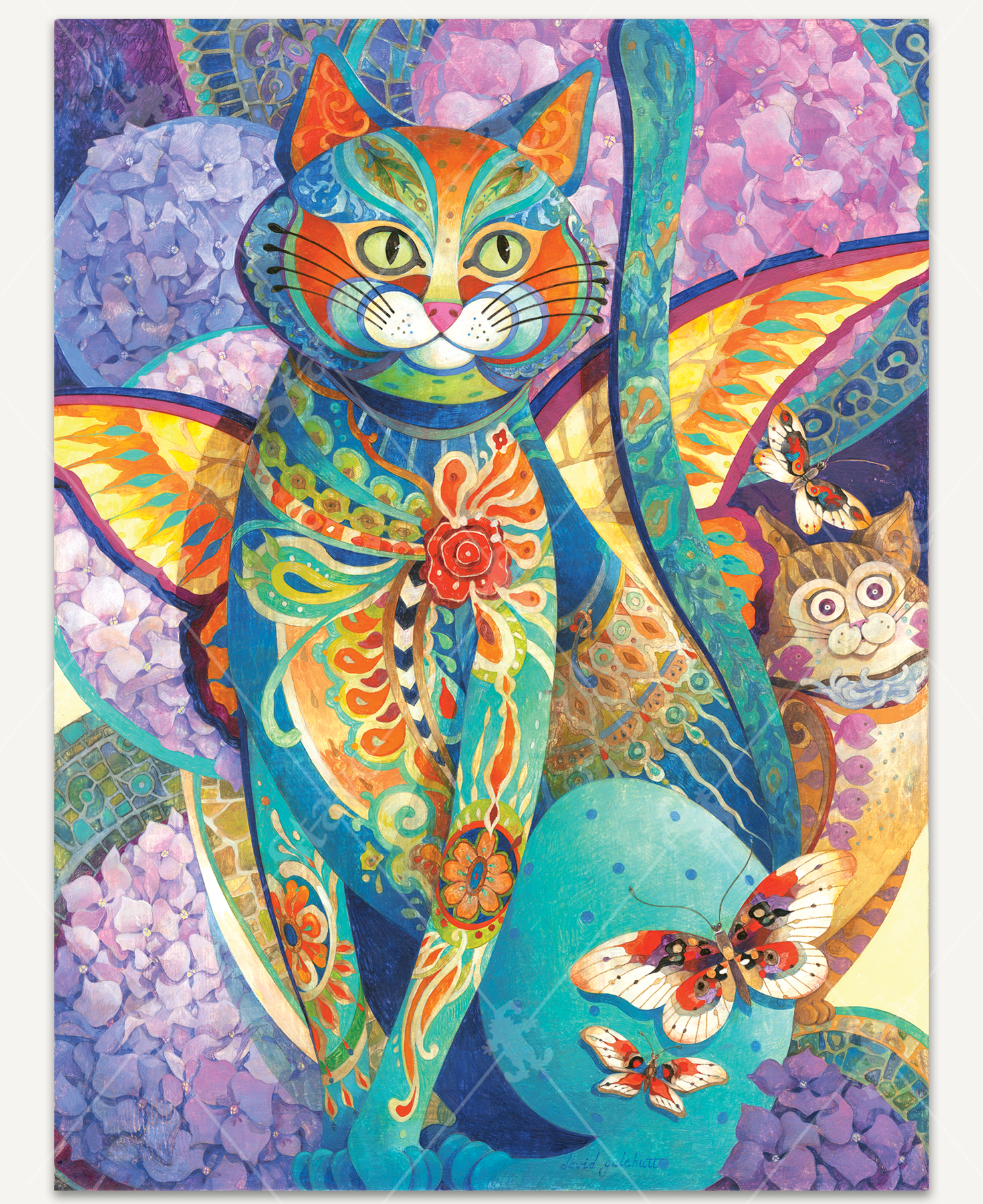 Feline Fiesta wooden jigsaw puzzle reveals a blue cat that is adorned with designs throughout its body and has butterfly wings. It sits in the center of the image, with lilacs filling the background. Another cat sits behind the feline on the right side, with a dazed look on its face.